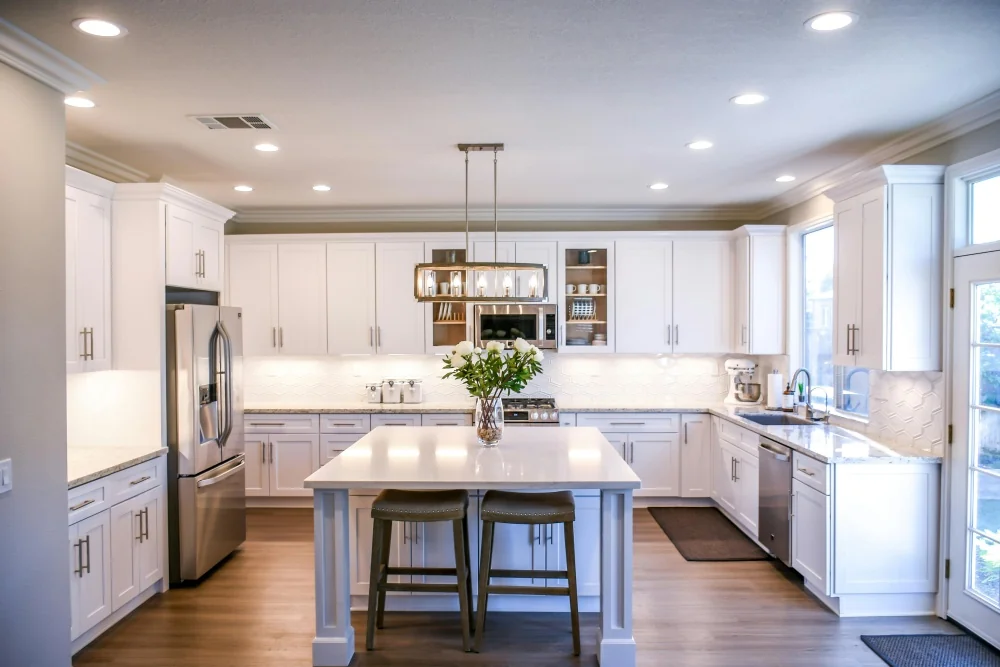 Newly renovated modern Kitchen with white cabinets and wood floor